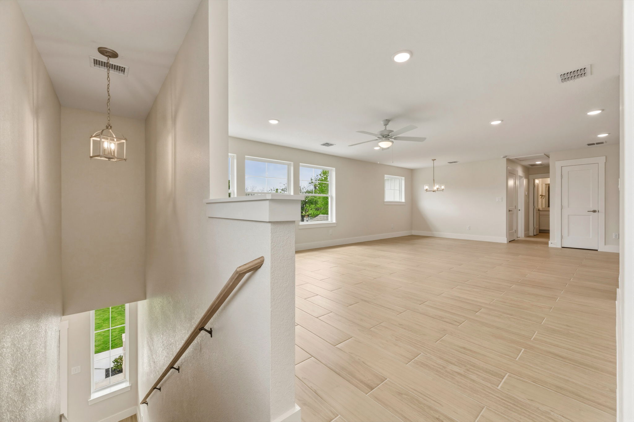 1412 Kent Street Taylor, TX 76574 - Photo 28 of 40 a view of an empty room with wooden floor and a window
