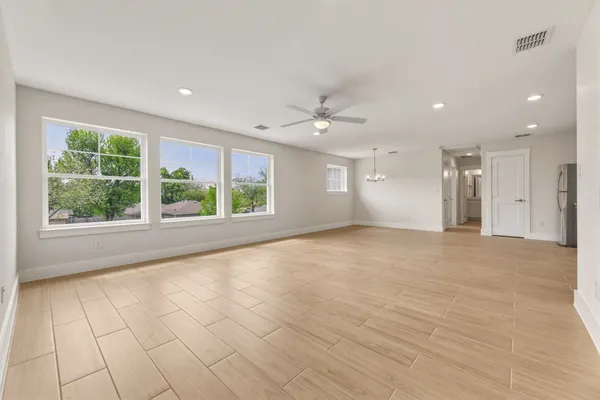 a view of an empty room with a window