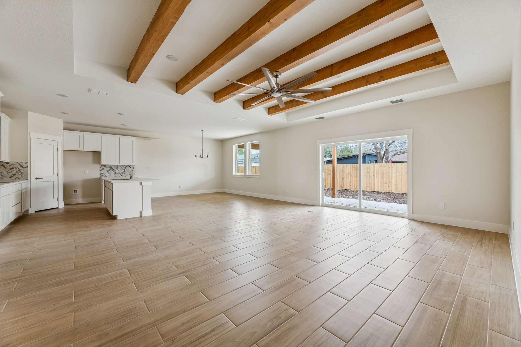 1412 Kent Street Taylor, TX 76574 - Photo 12 of 12 Great open floor plan with large kitchen island, pantry, dining, living - heart of the home.