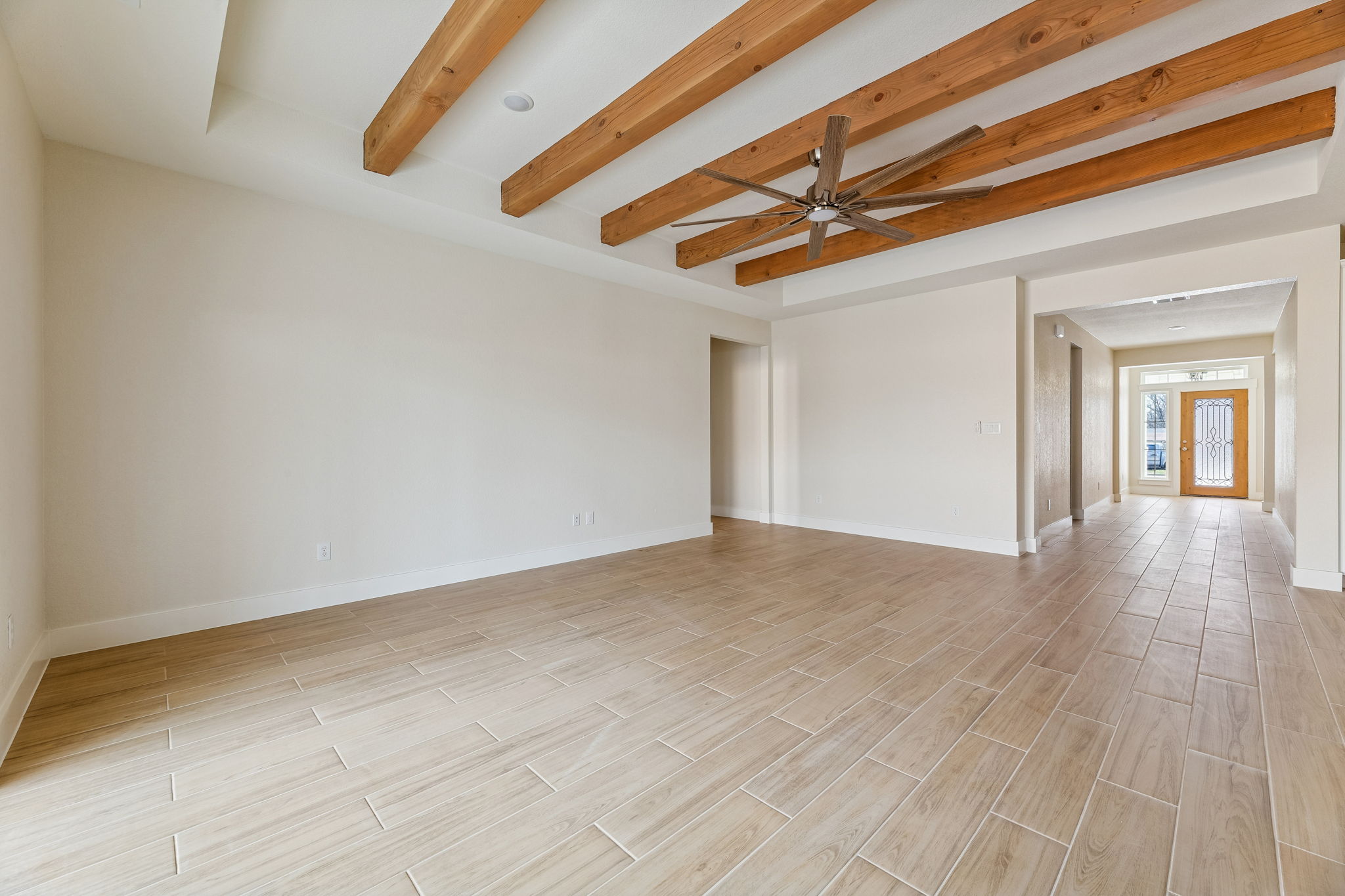 1412 Kent Street Taylor, TX 76574 - Photo 5 of 12 Living room with hallway to front door.