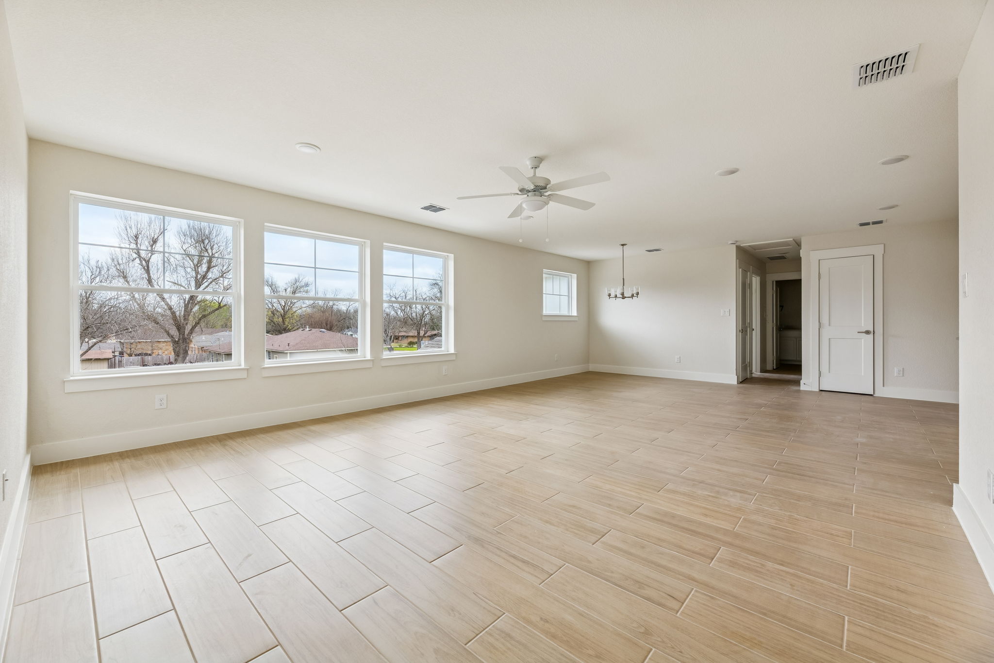 1412 Kent Street Taylor, TX 76574 - Photo 7 of 12 Guest Quarters - view from entrance looking at living room with lots of natural light.