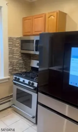 a stove top oven sitting inside of a kitchen