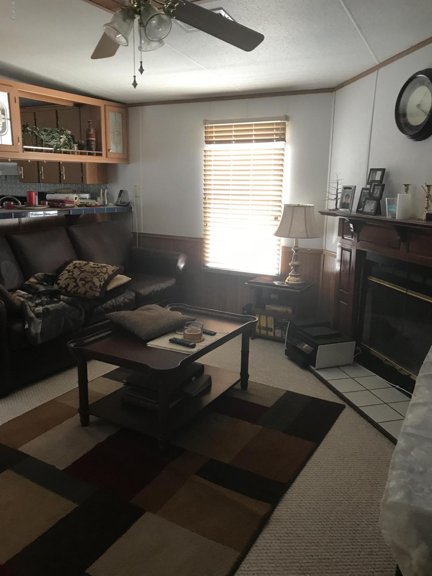 96541 Chester Road Yulee, FL 32097 - Photo 17 of 20 a living room with furniture and a window
