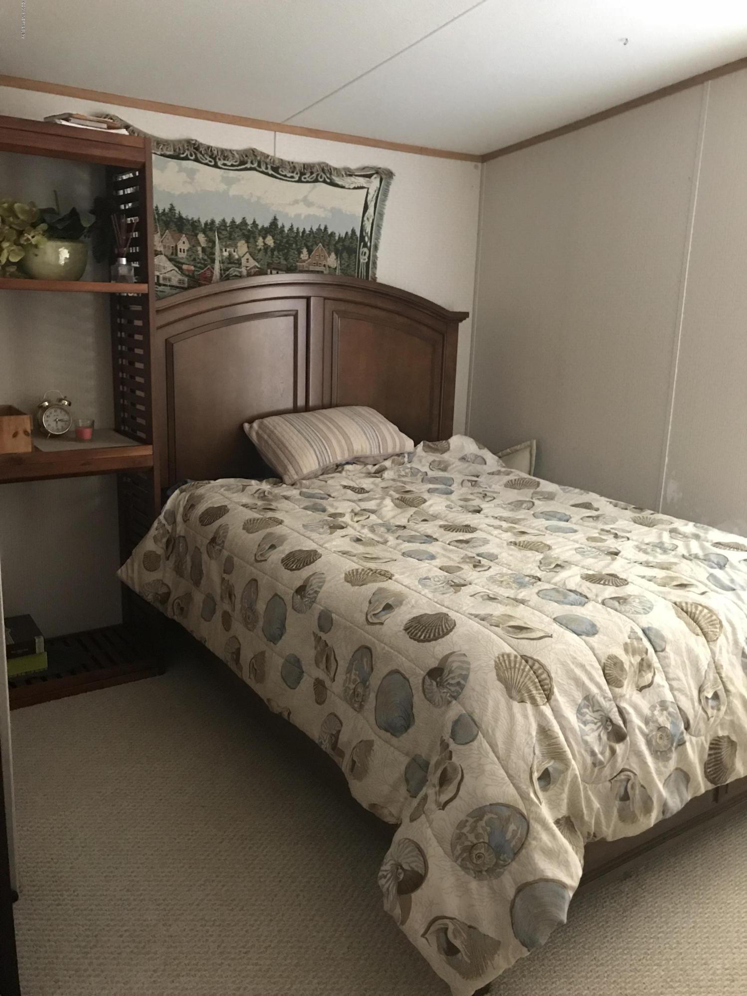 96541 Chester Road Yulee, FL 32097 - Photo 18 of 20 a bedroom with a bed and dresser