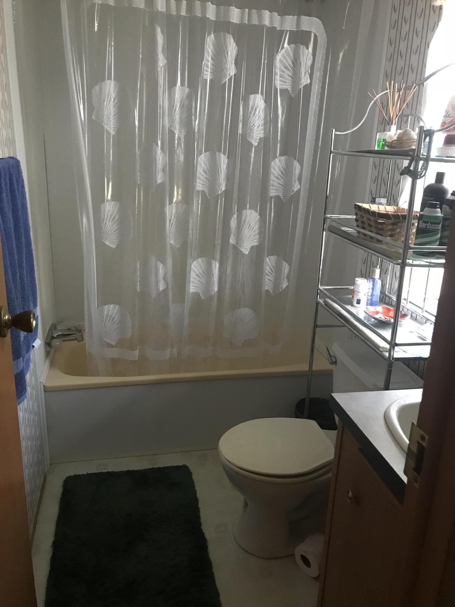 96541 Chester Road Yulee, FL 32097 - Photo 19 of 20 a bathroom with a toilet and a shower
