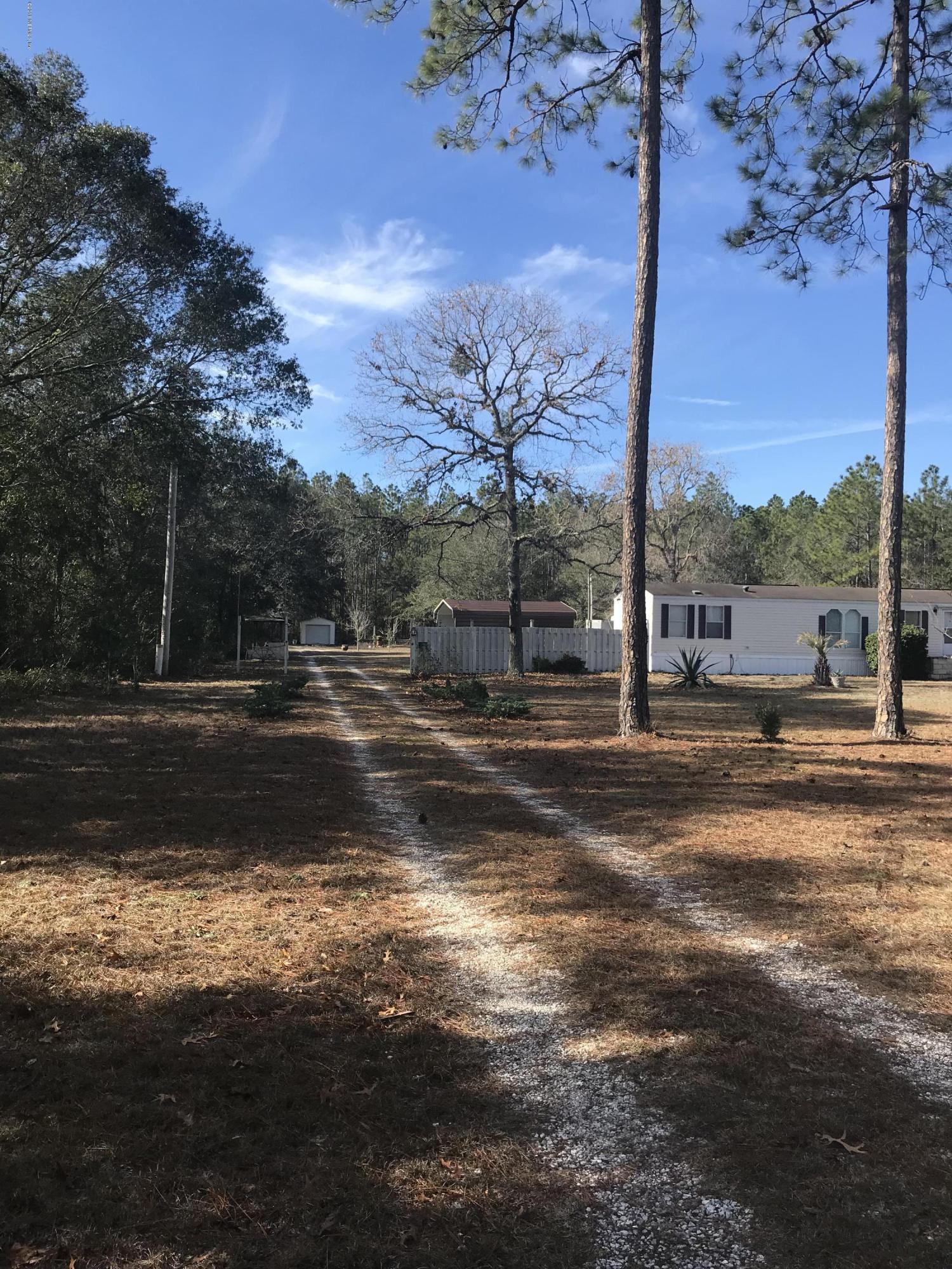 96541 Chester Road Yulee, FL 32097 - Photo 3 of 20 a view of street with a yard