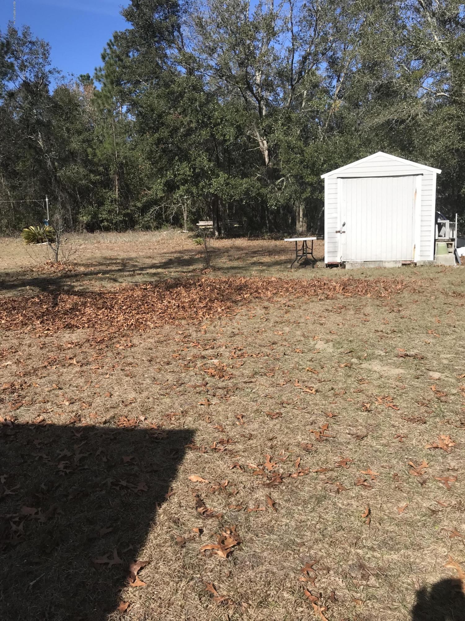 96541 Chester Road Yulee, FL 32097 - Photo 8 of 20 a view of a backyard