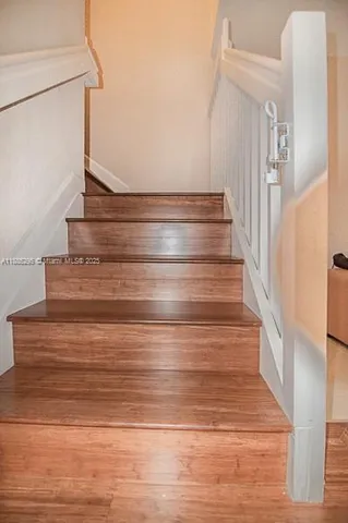 an empty room with wooden floor
