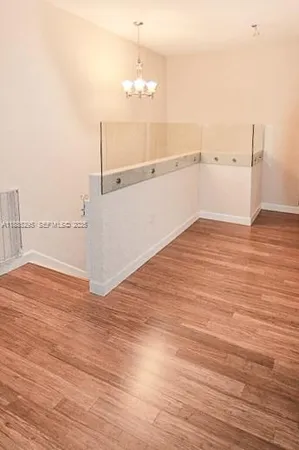 an empty room with wooden floor