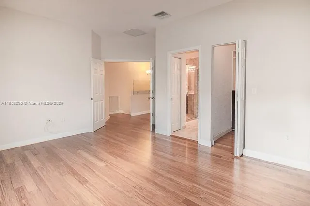 a view of a kitchen from the hallway