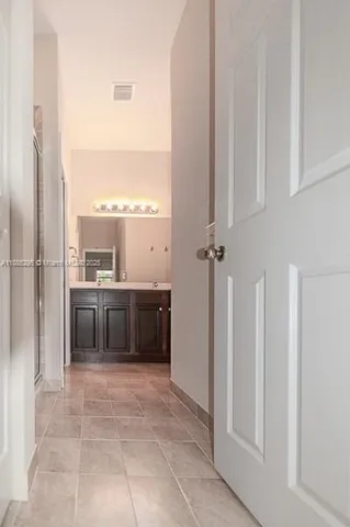 a bathroom with a toilet and a vanity