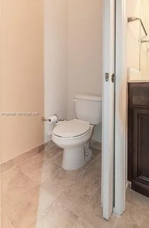 a bathroom with a sink shower and a mirror