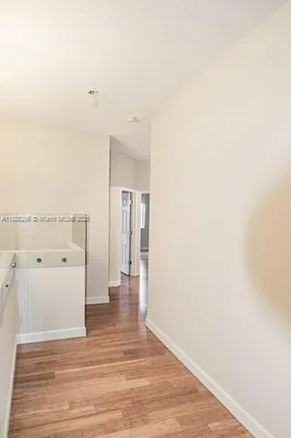 a bathroom with a sink double vanity and a bathtub