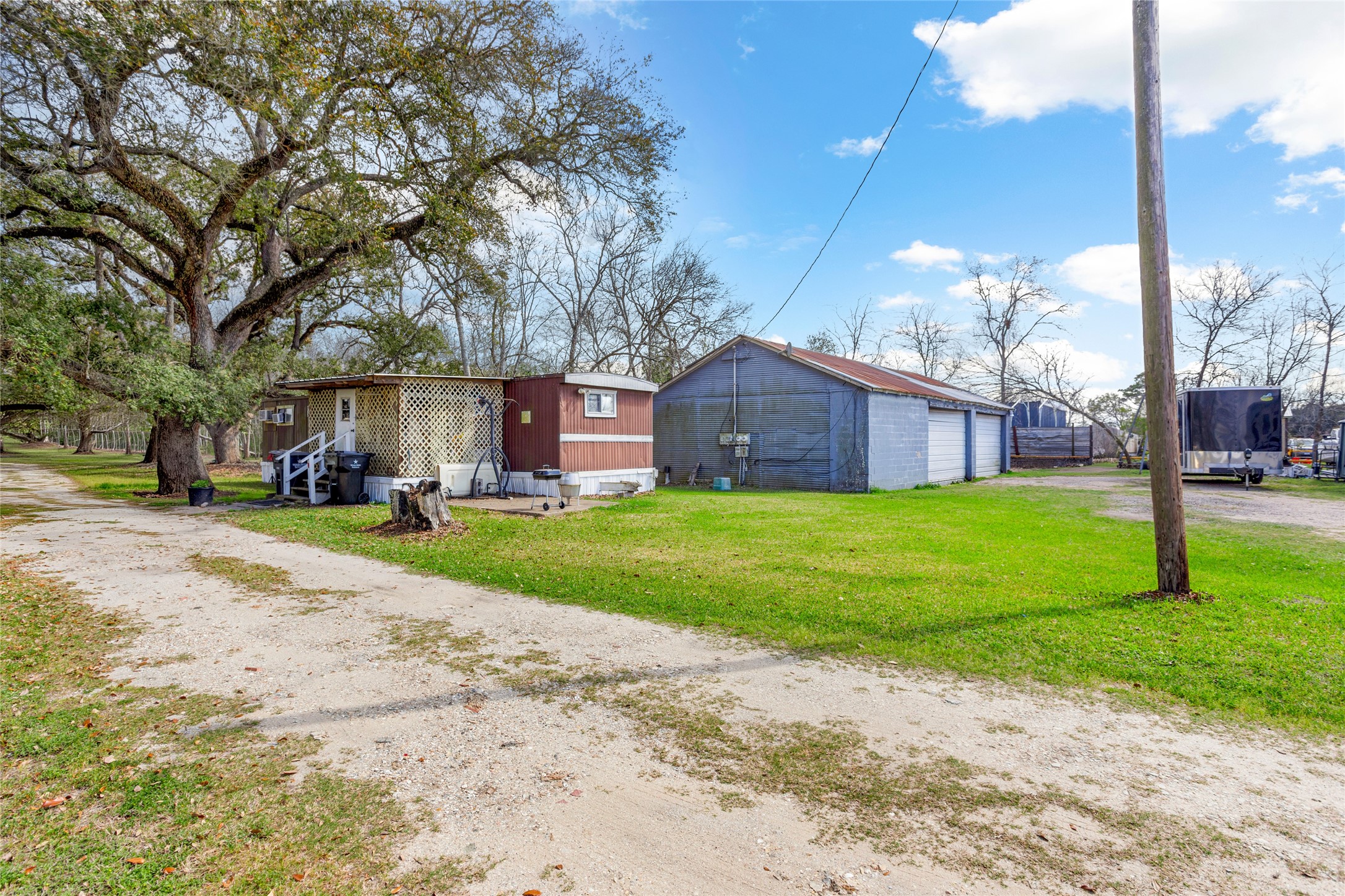 1806 FM 528 Road Alvin, TX 77511 - Photo 13 of 17 a view of a street with a building and trees in the background