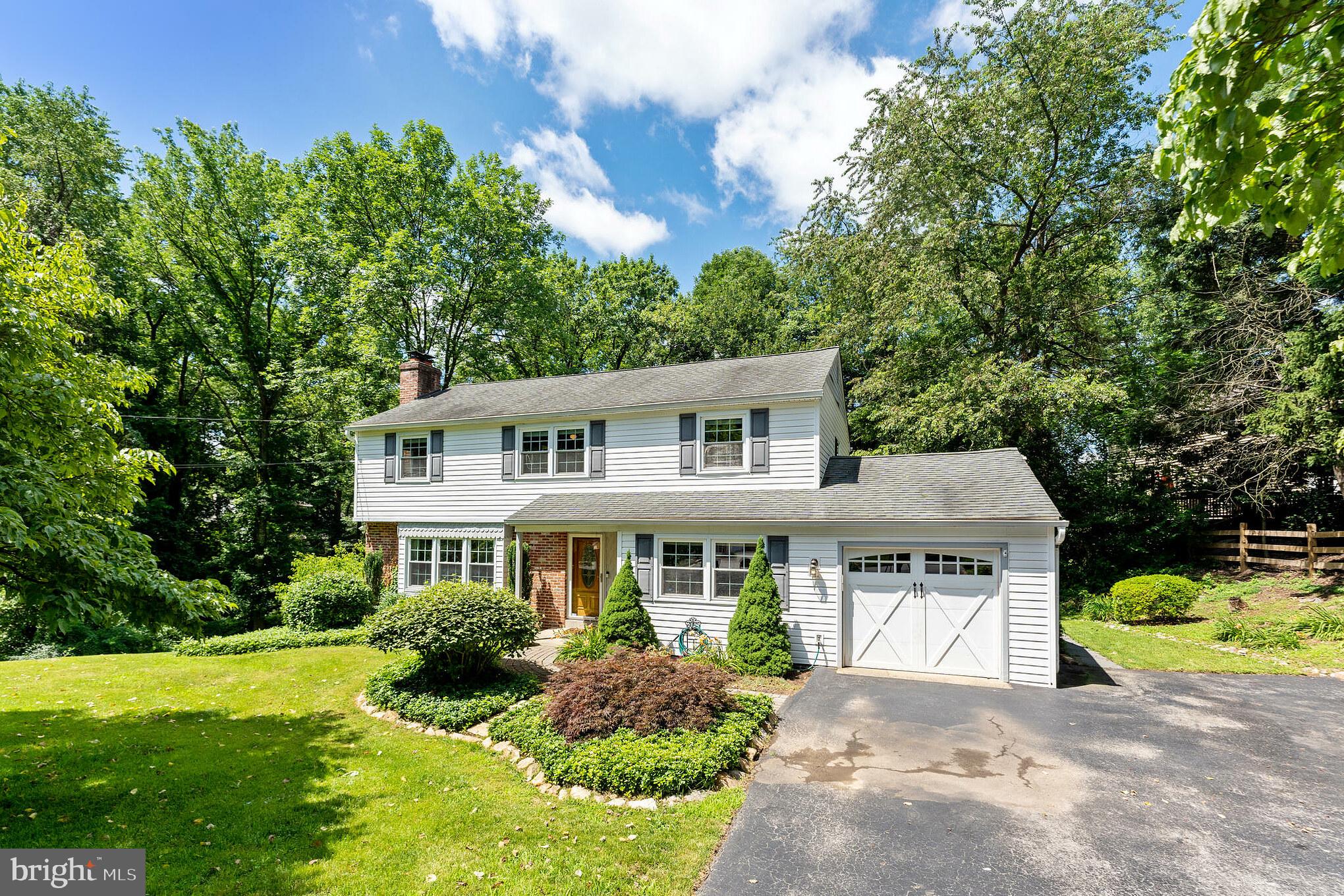 1070 Dale Road Media, PA 19063 - Photo 1 of 40 a front view of a house with a yard and potted plants