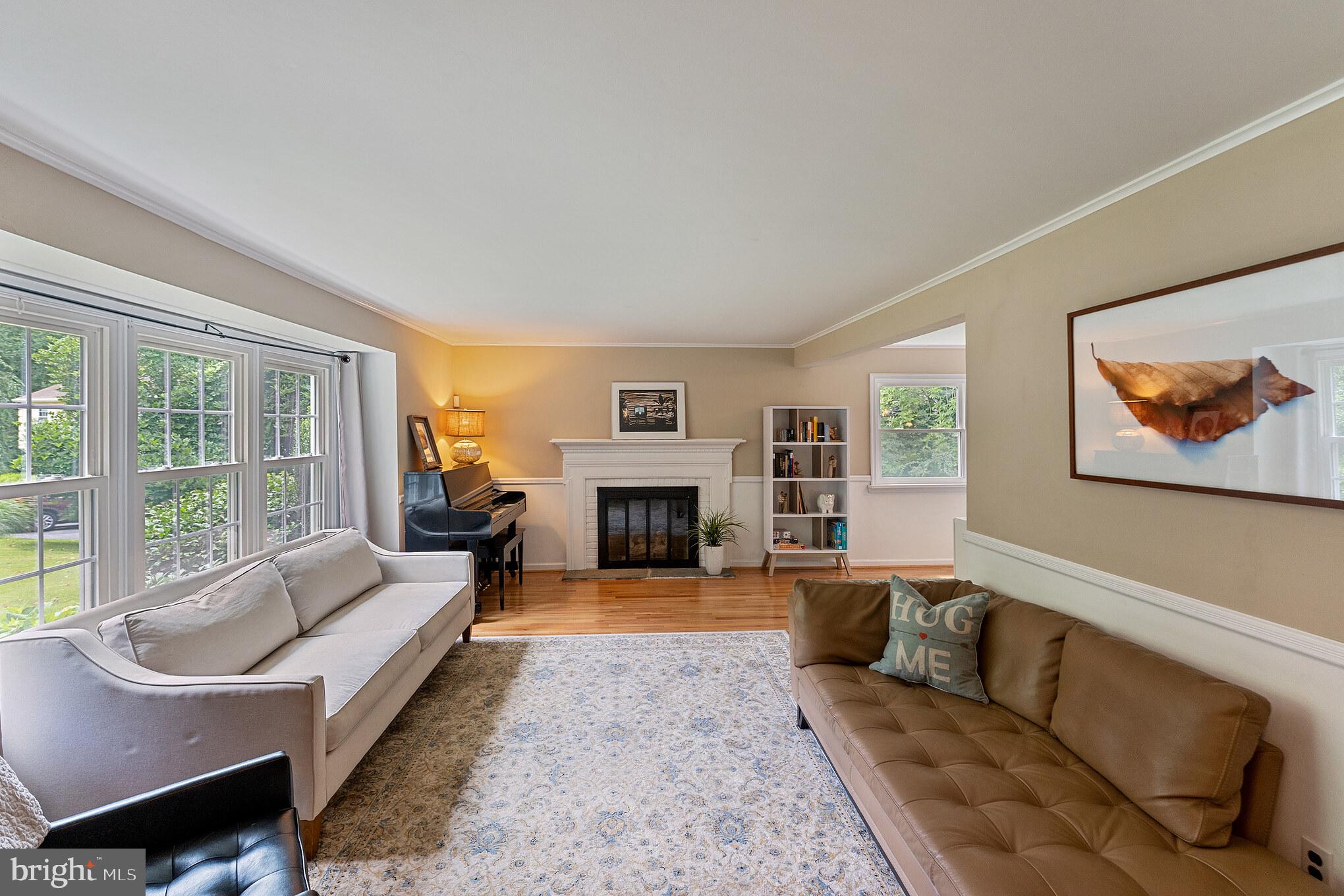 1070 Dale Road Media, PA 19063 - Photo 2 of 40 a living room with furniture large window and a fireplace