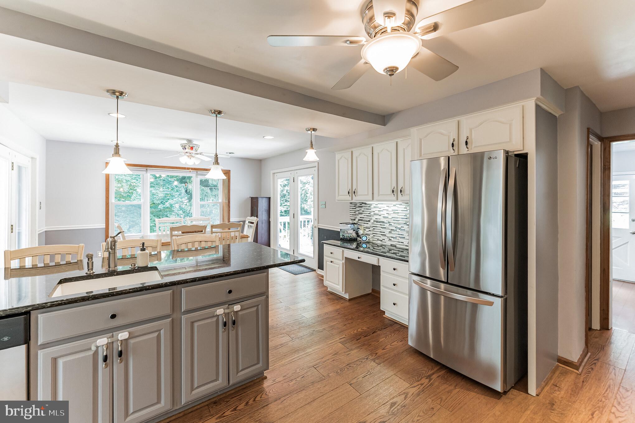 1070 Dale Road Media, PA 19063 - Photo 17 of 40 a kitchen with stainless steel appliances a sink cabinets and wooden floor