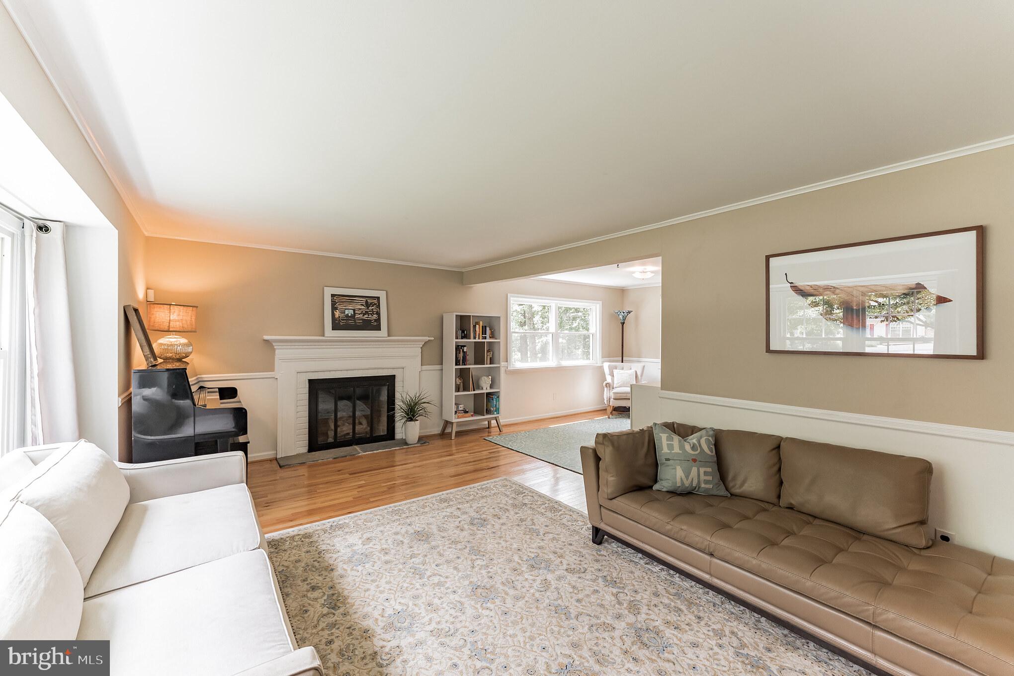 1070 Dale Road Media, PA 19063 - Photo 4 of 40 a living room with furniture a fireplace and a large window
