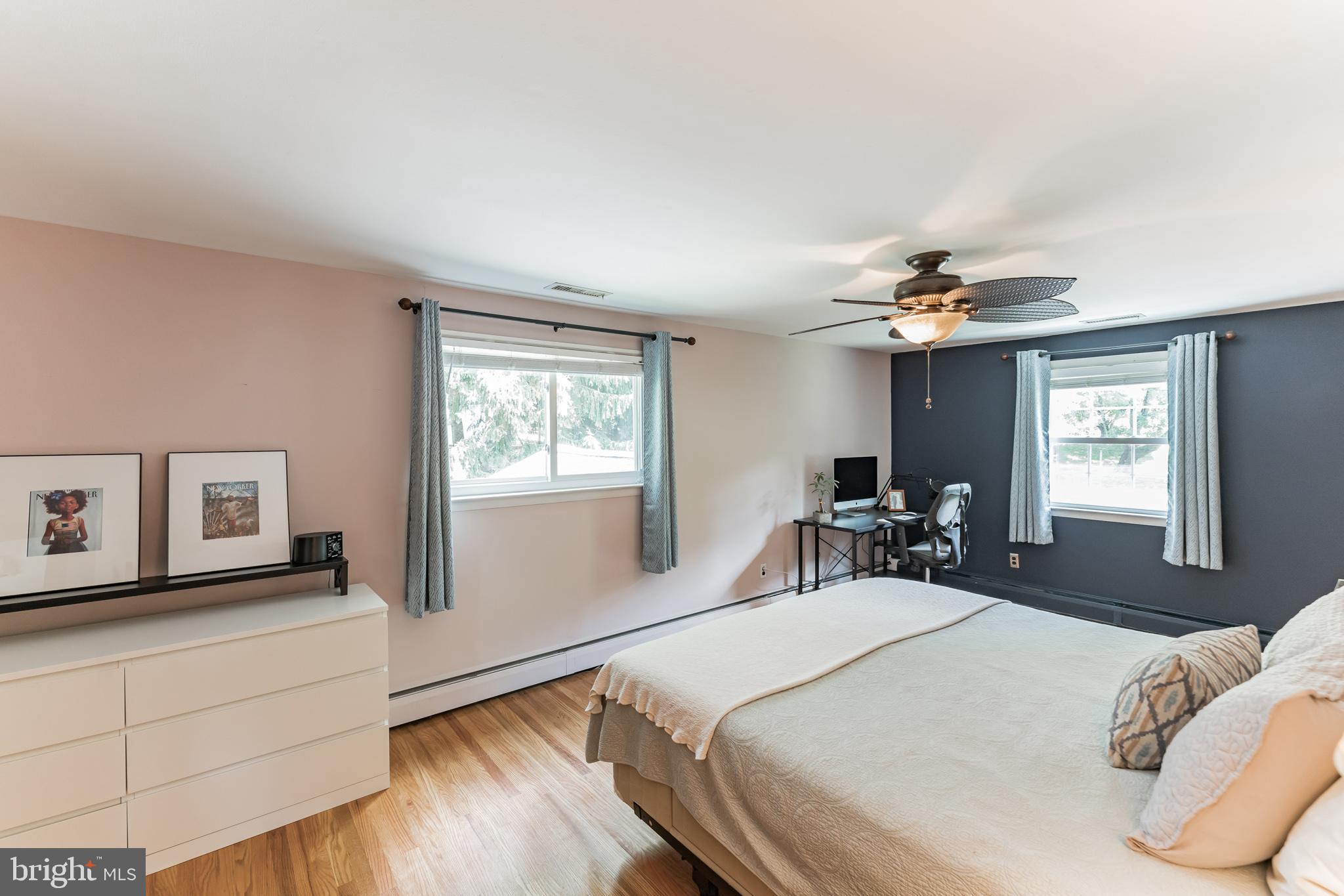 1070 Dale Road Media, PA 19063 - Photo 31 of 40 a bedroom with a bed and a chandelier