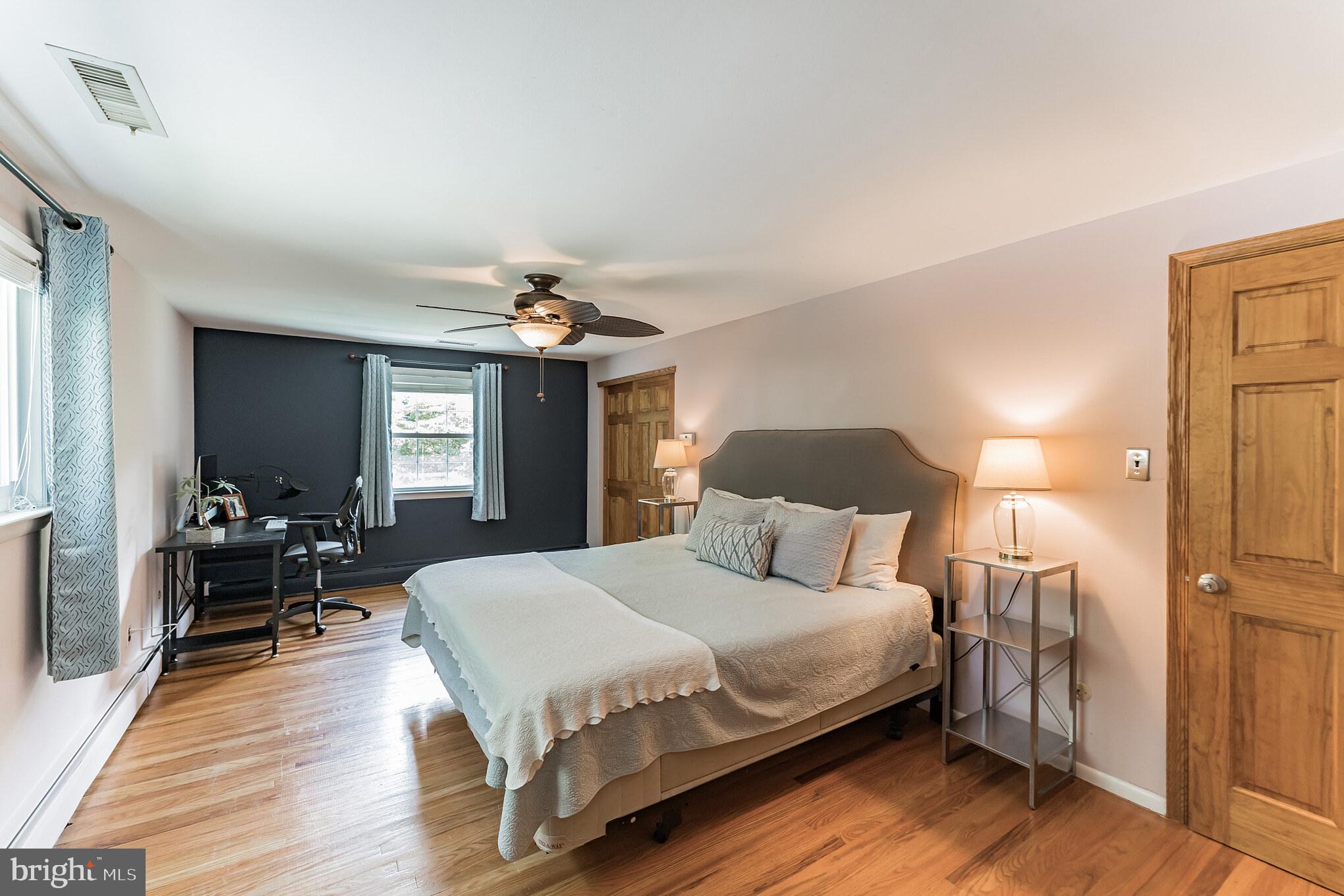 1070 Dale Road Media, PA 19063 - Photo 32 of 40 a bedroom with a bed and wooden floor