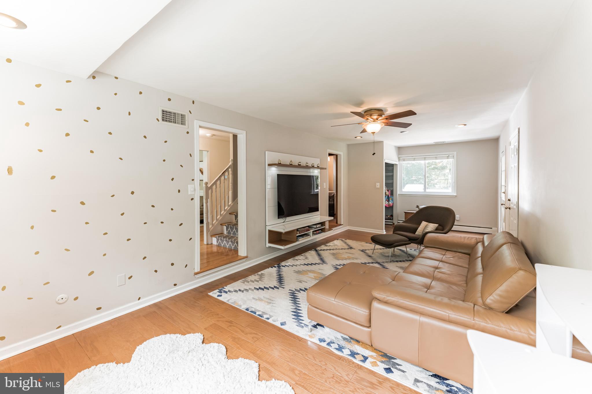 1070 Dale Road Media, PA 19063 - Photo 9 of 40 a living room with furniture and a flat screen tv