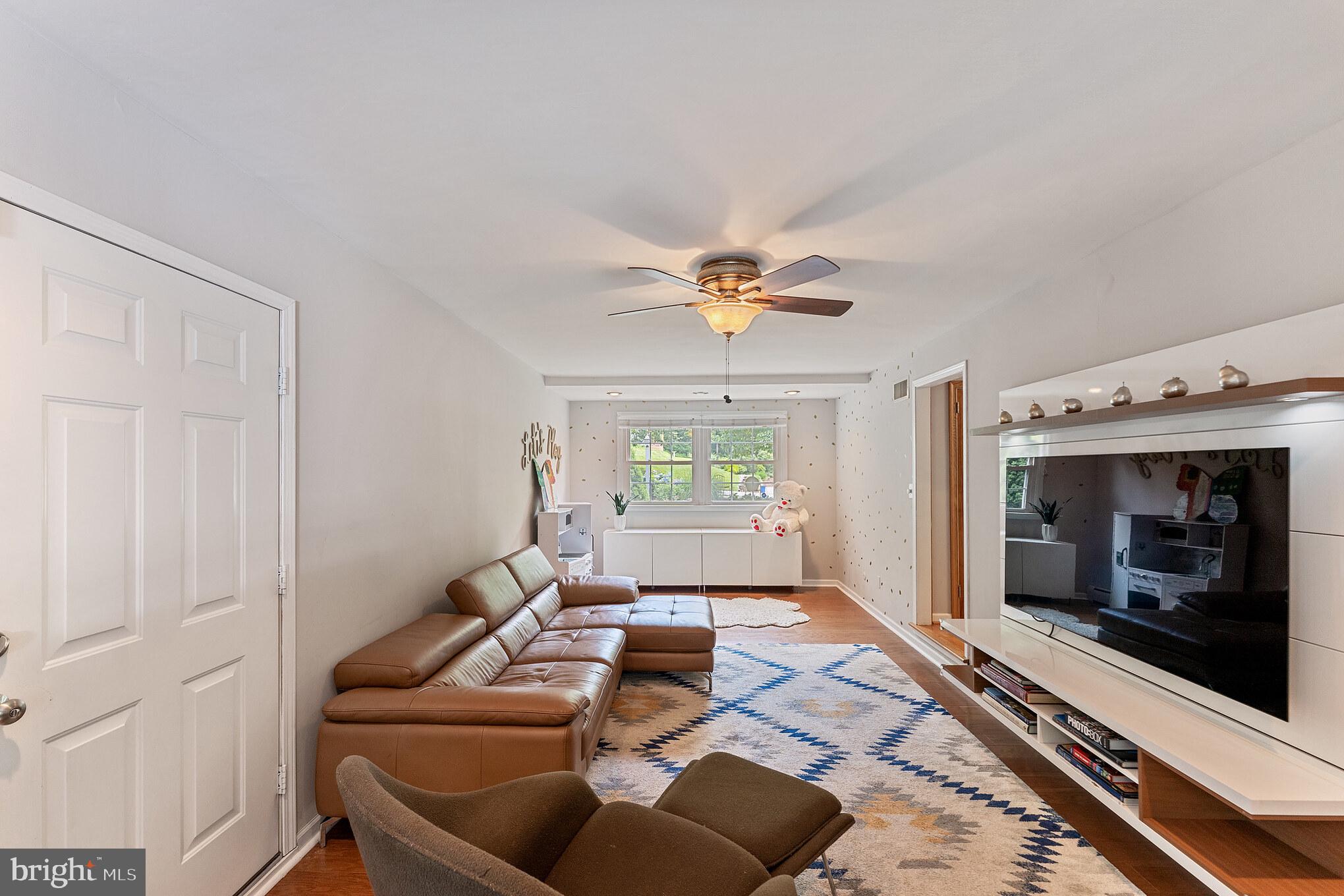 1070 Dale Road Media, PA 19063 - Photo 10 of 40 a living room with furniture and a fireplace