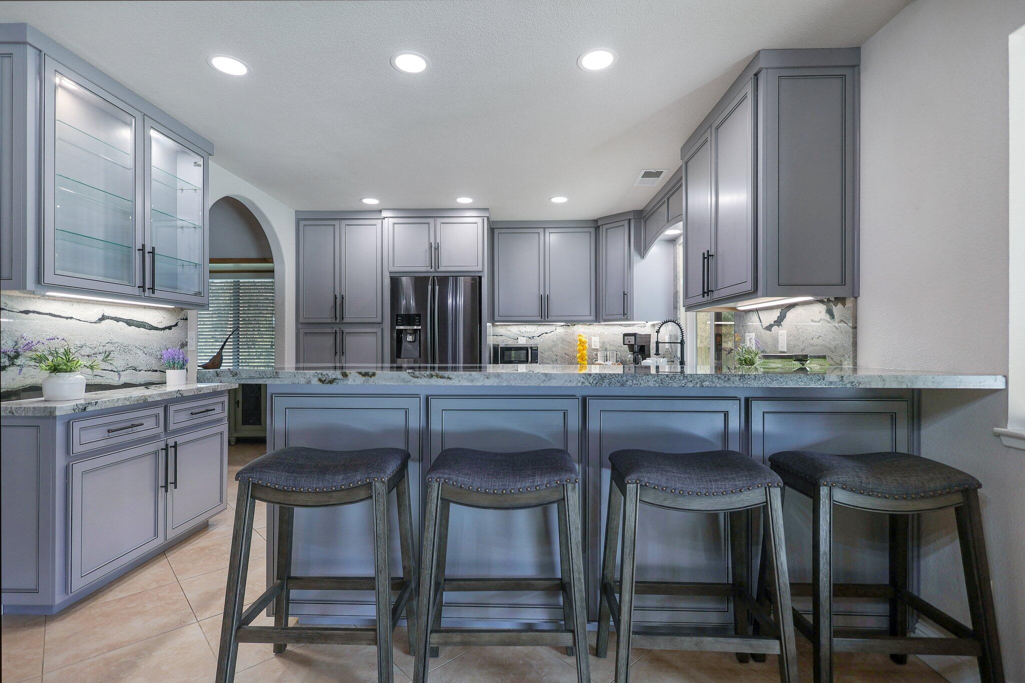 21365 Dersch Road Anderson, CA 96007 - Photo 11 of 55 a kitchen with granite countertop a counter space chairs stainless steel appliances and cabinets