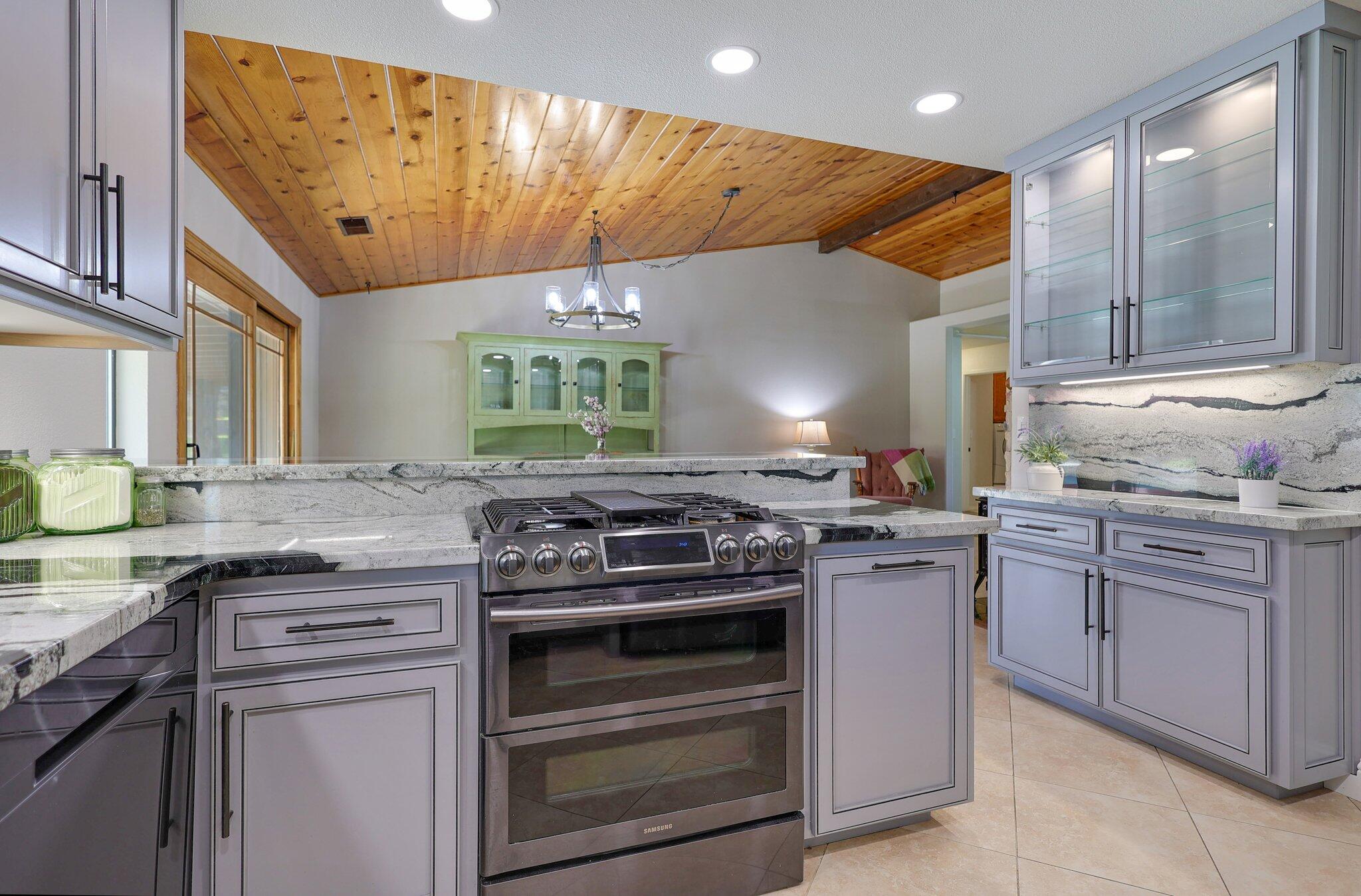 21365 Dersch Road Anderson, CA 96007 - Photo 14 of 55 a kitchen with stainless steel appliances granite countertop a stove and a sink