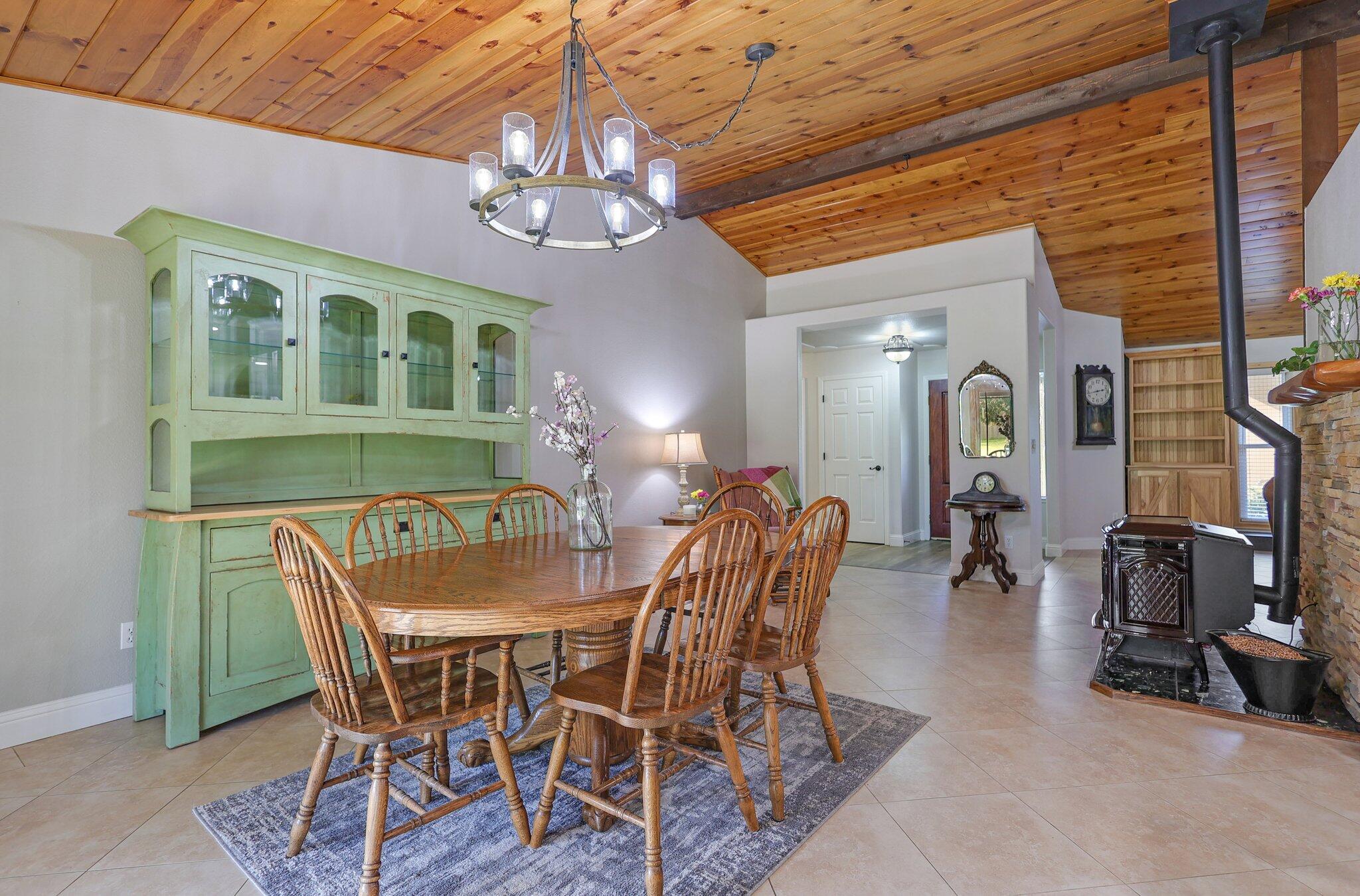 21365 Dersch Road Anderson, CA 96007 - Photo 15 of 55 a view of a dining room with furniture and chandelier