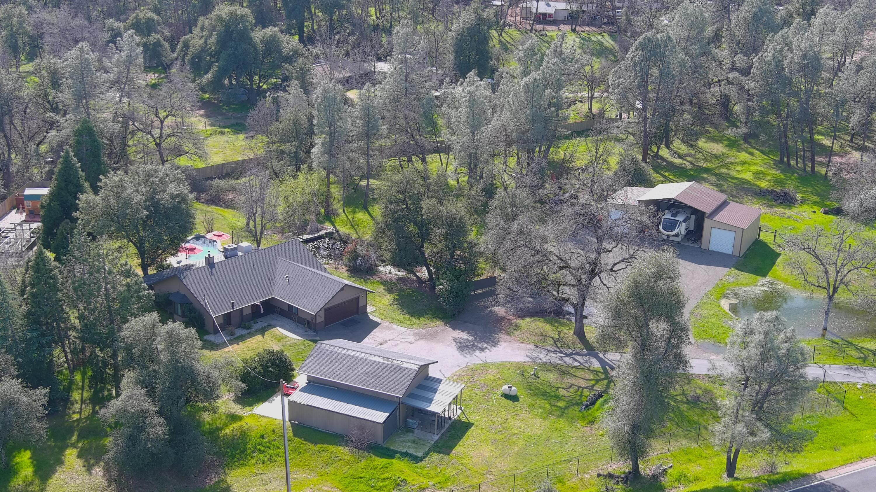 21365 Dersch Road Anderson, CA 96007 - Photo 2 of 55 an aerial view of a house with a garden and swimming pool