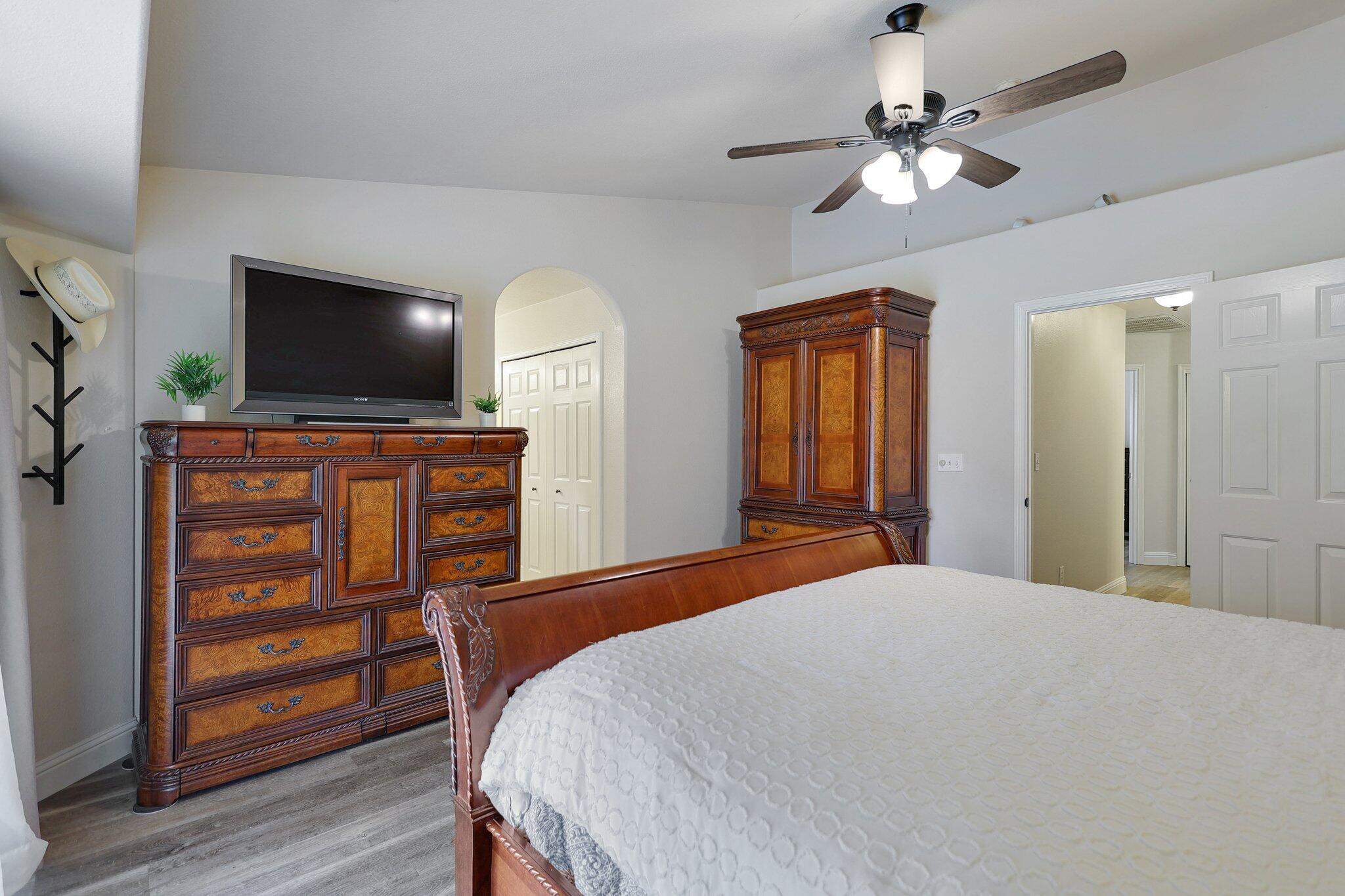 21365 Dersch Road Anderson, CA 96007 - Photo 27 of 55 a bedroom with a bed and a flat screen tv