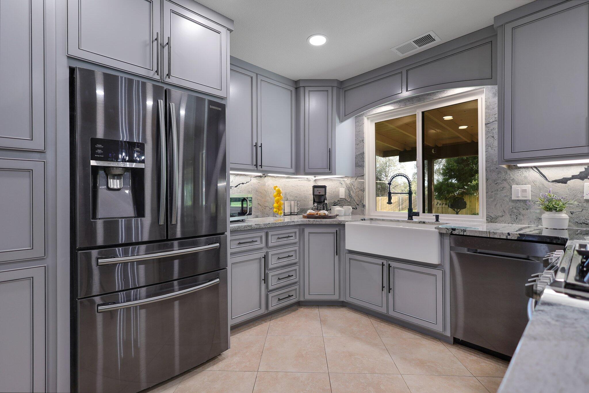 21365 Dersch Road Anderson, CA 96007 - Photo 3 of 55 a kitchen with stainless steel appliances granite countertop a refrigerator and a sink