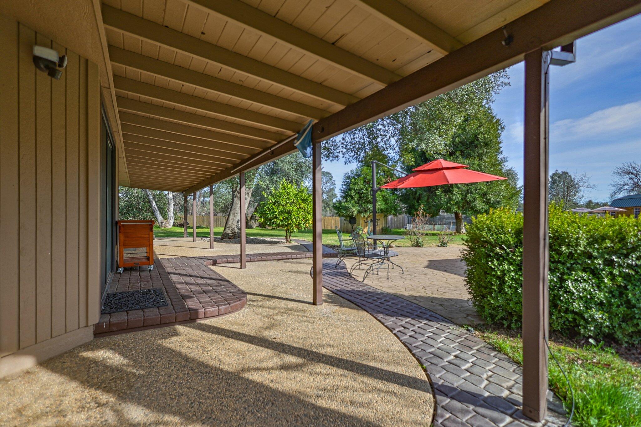 21365 Dersch Road Anderson, CA 96007 - Photo 33 of 55 a patio with a patio table and chairs