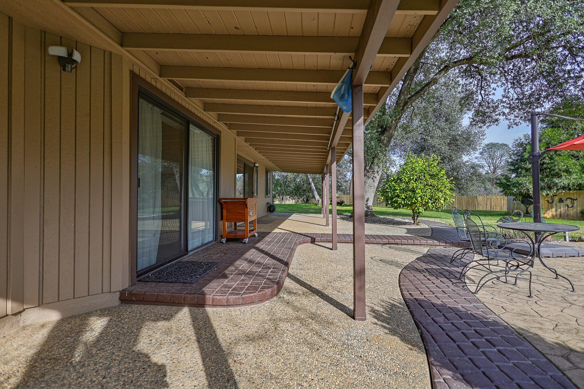 21365 Dersch Road Anderson, CA 96007 - Photo 34 of 55 a view of a porch with furniture and a yard