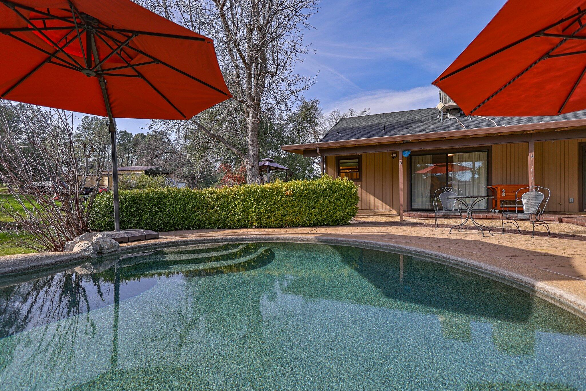 21365 Dersch Road Anderson, CA 96007 - Photo 35 of 55 a view of house with swimming pool and outdoor seating