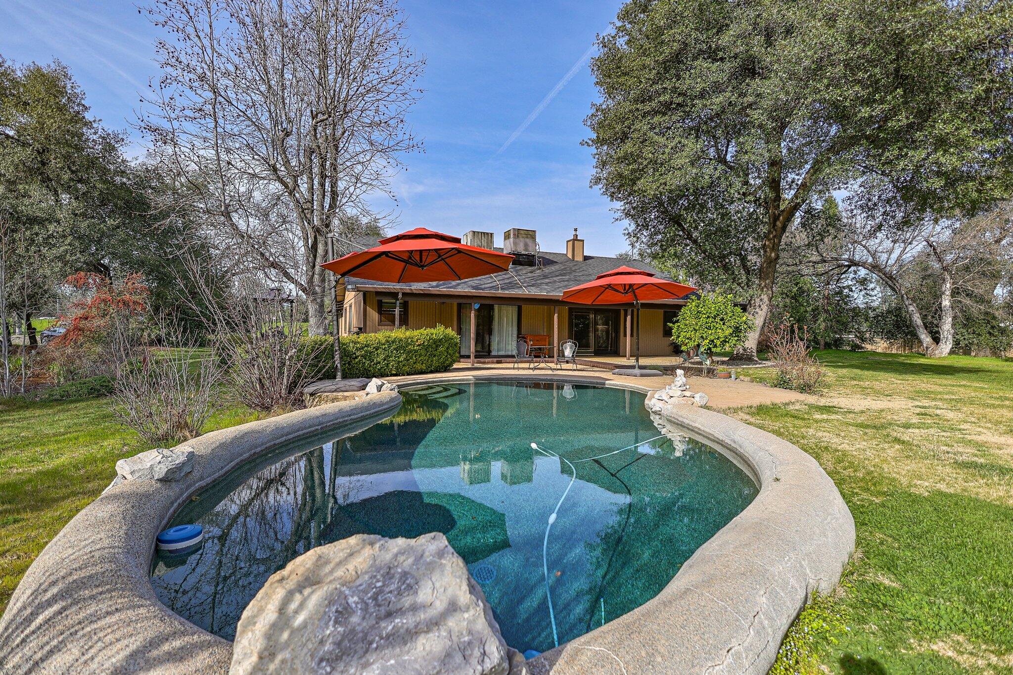 21365 Dersch Road Anderson, CA 96007 - Photo 4 of 55 a view of a house with a yard patio and fire pit
