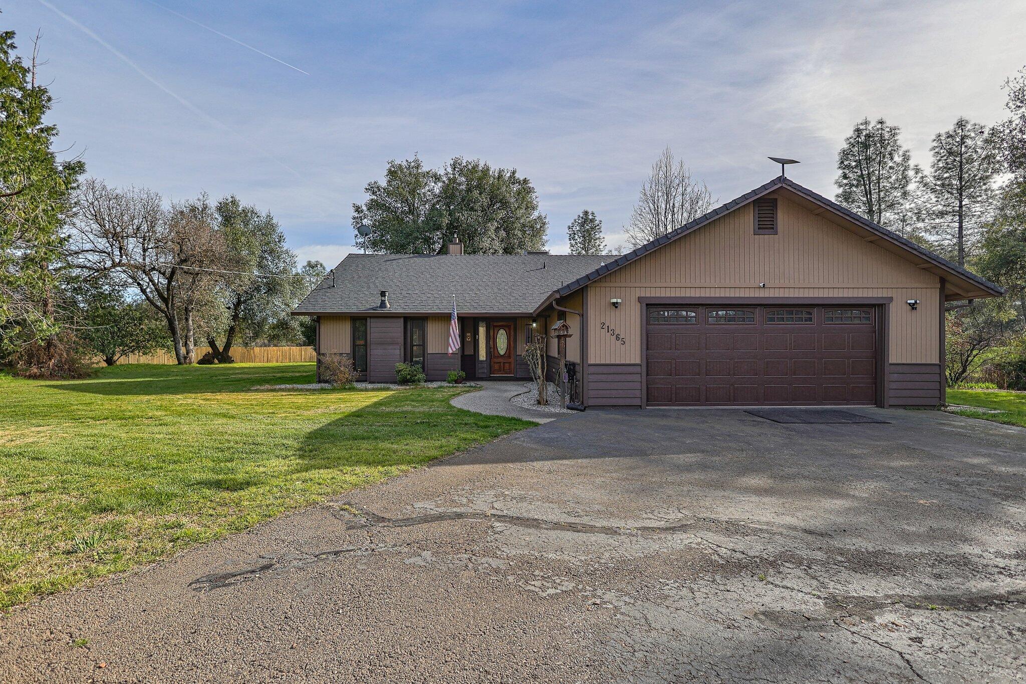 21365 Dersch Road Anderson, CA 96007 - Photo 42 of 55 a front view of a house with a yard and garage