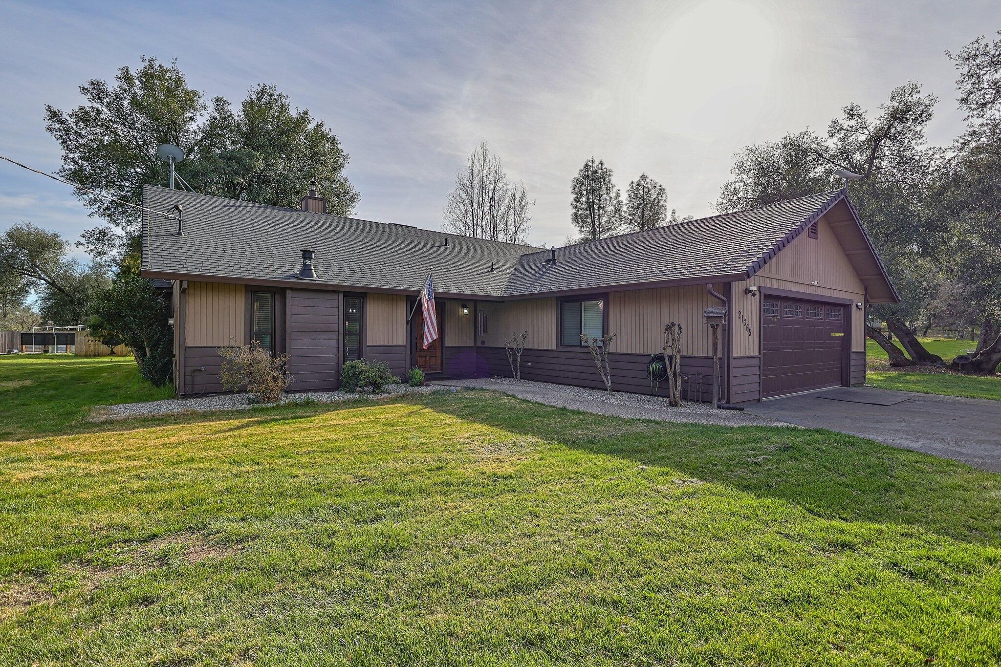 21365 Dersch Road Anderson, CA 96007 - Photo 5 of 55 a view of a yard in front of a house with large tree