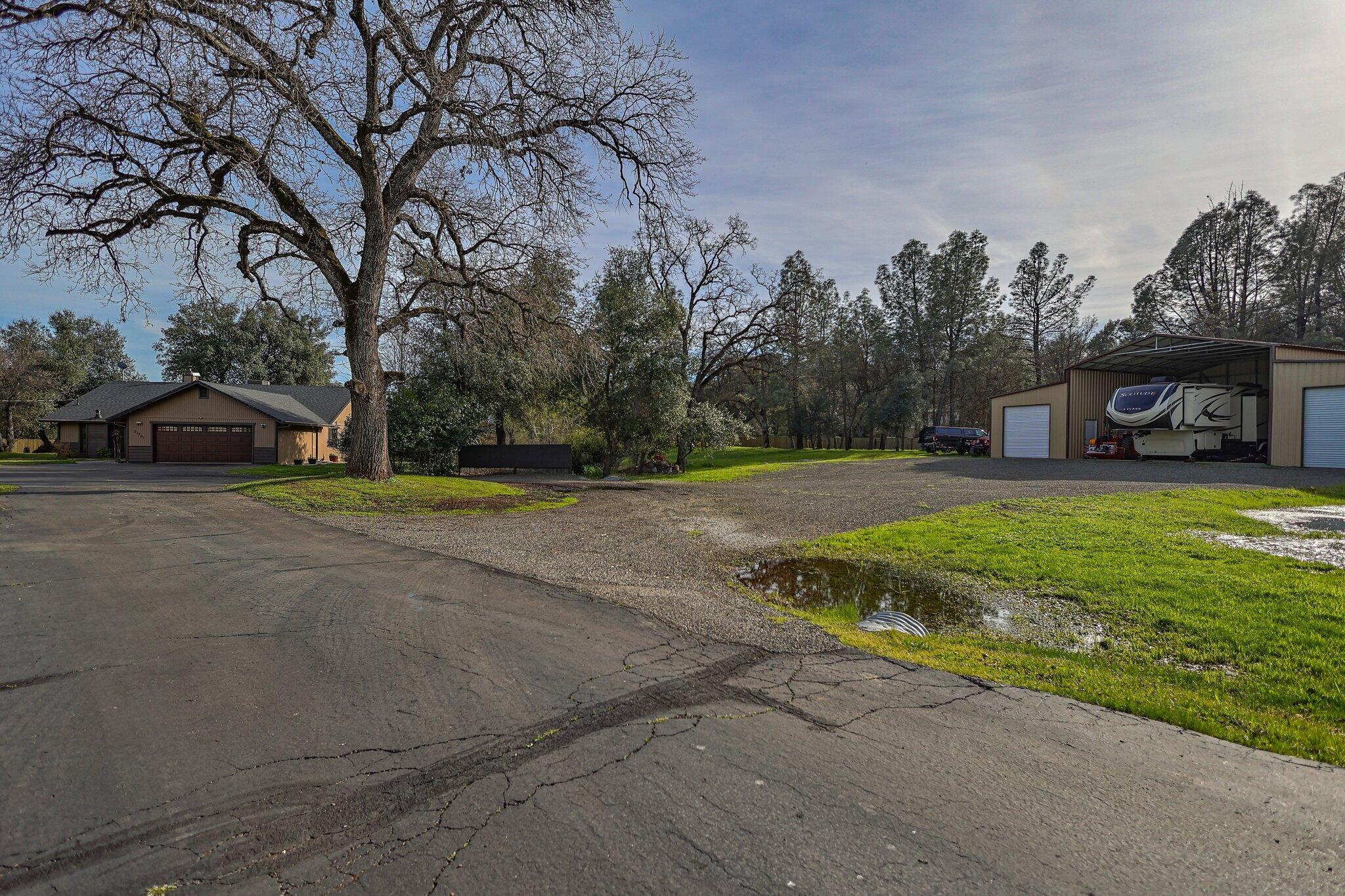 21365 Dersch Road Anderson, CA 96007 - Photo 52 of 55 a view of a house with a big yard and large trees