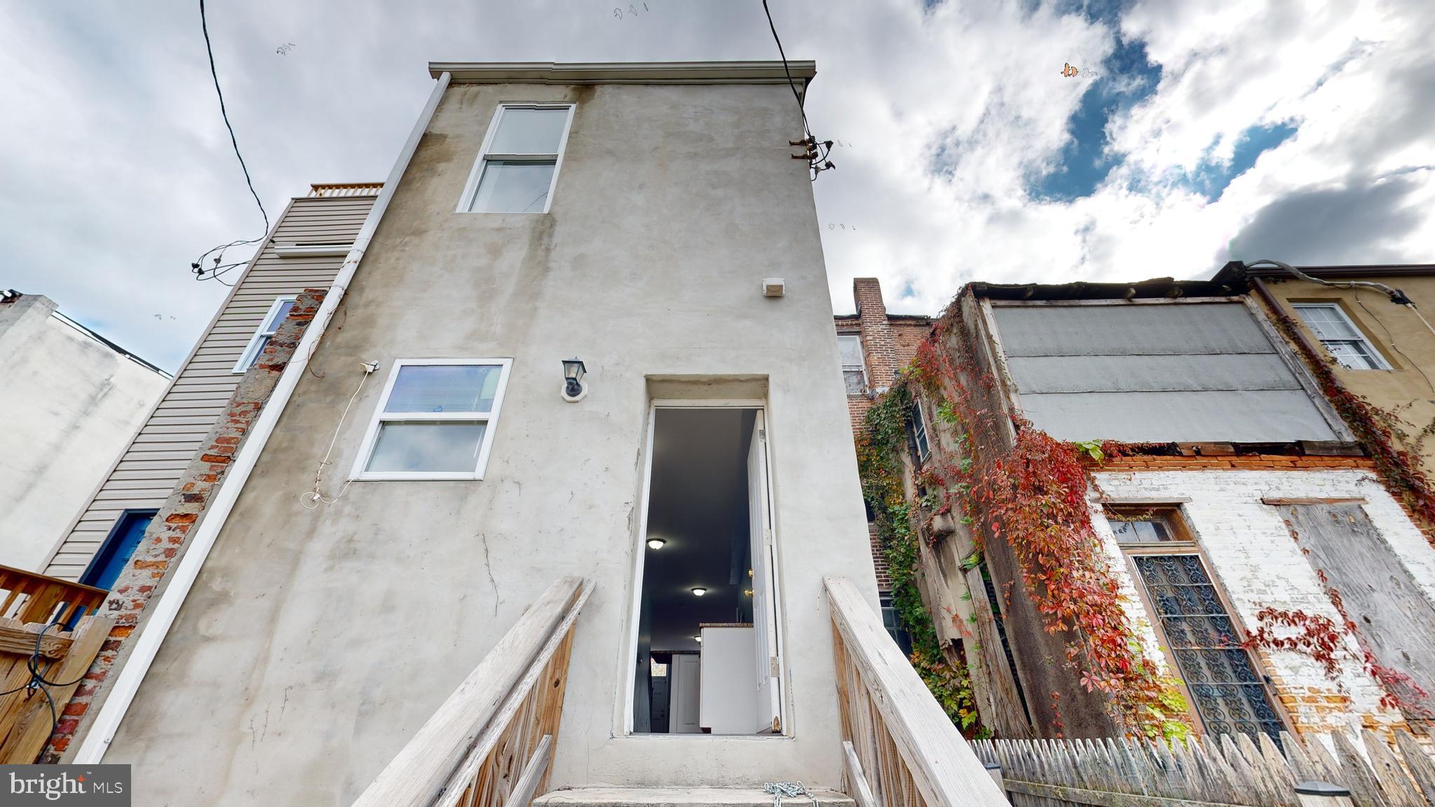 1826 North Caroline Street Baltimore, MD 21213 - Photo 11 of 59 Rear stucco finish