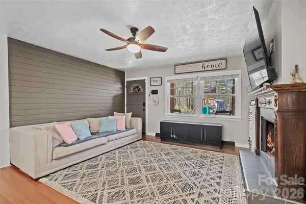 a living room with furniture and a fireplace