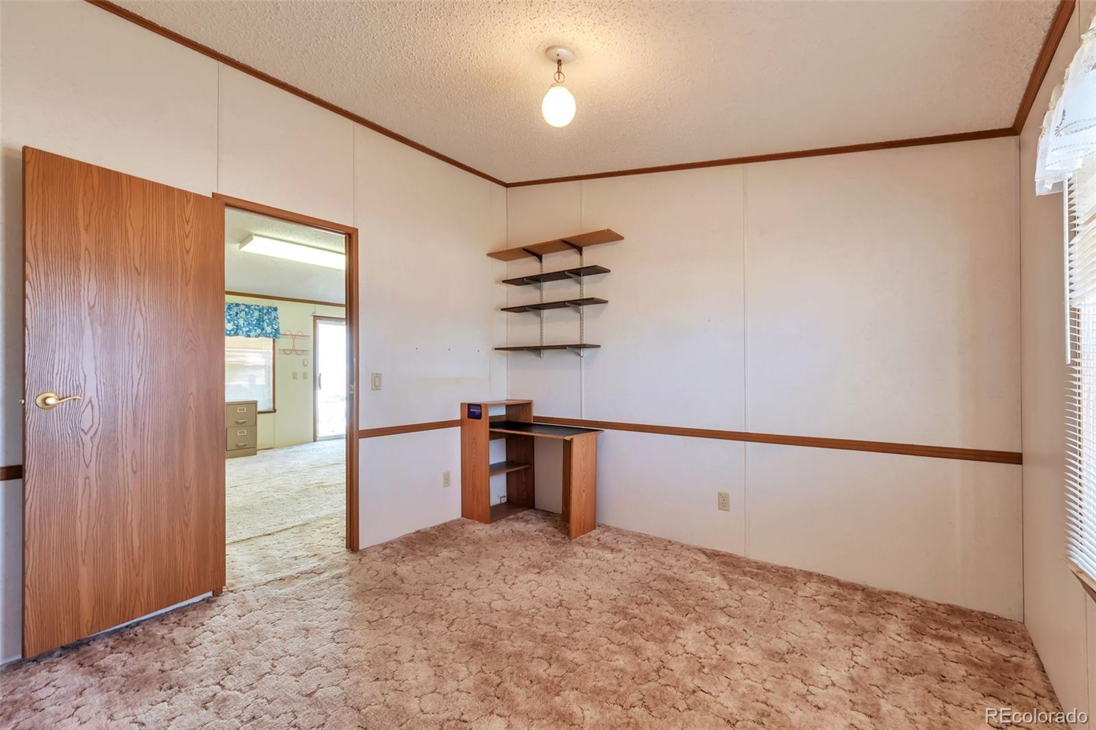 7702 Hart Street Fort Lupton, CO 80621 - Photo 19 of 25 a view of an empty room