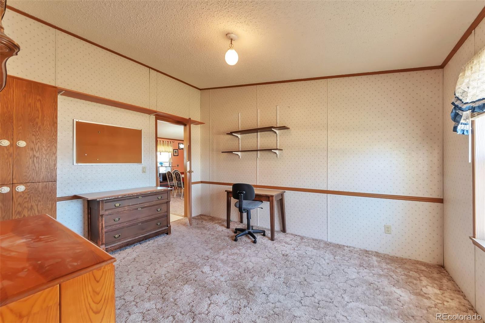 7702 Hart Street Fort Lupton, CO 80621 - Photo 22 of 25 a view of a workspace