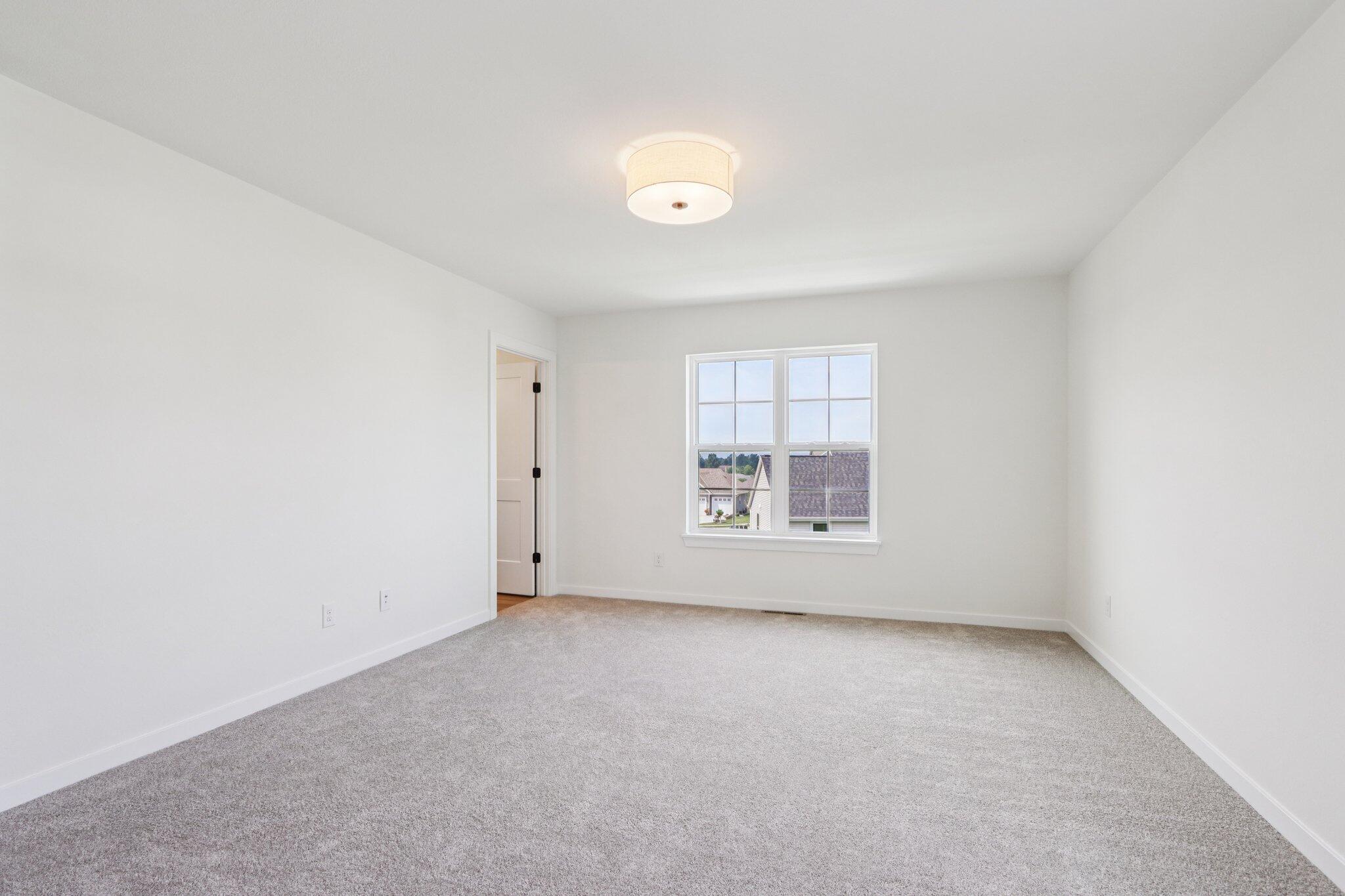 665 Mary Way Slinger, WI 53086 - Photo 11 of 27 665 Mary Way 11 Primary Bedroom