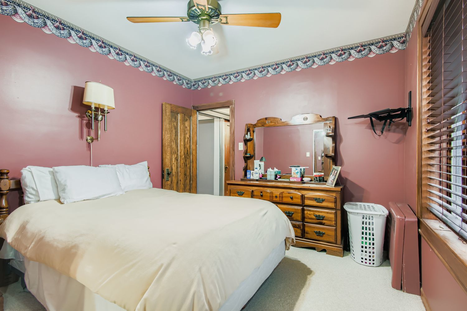 10522 South Leavitt Street Chicago, IL 60643 - Photo 14 of 24 a bedroom with a bed and a chandelier