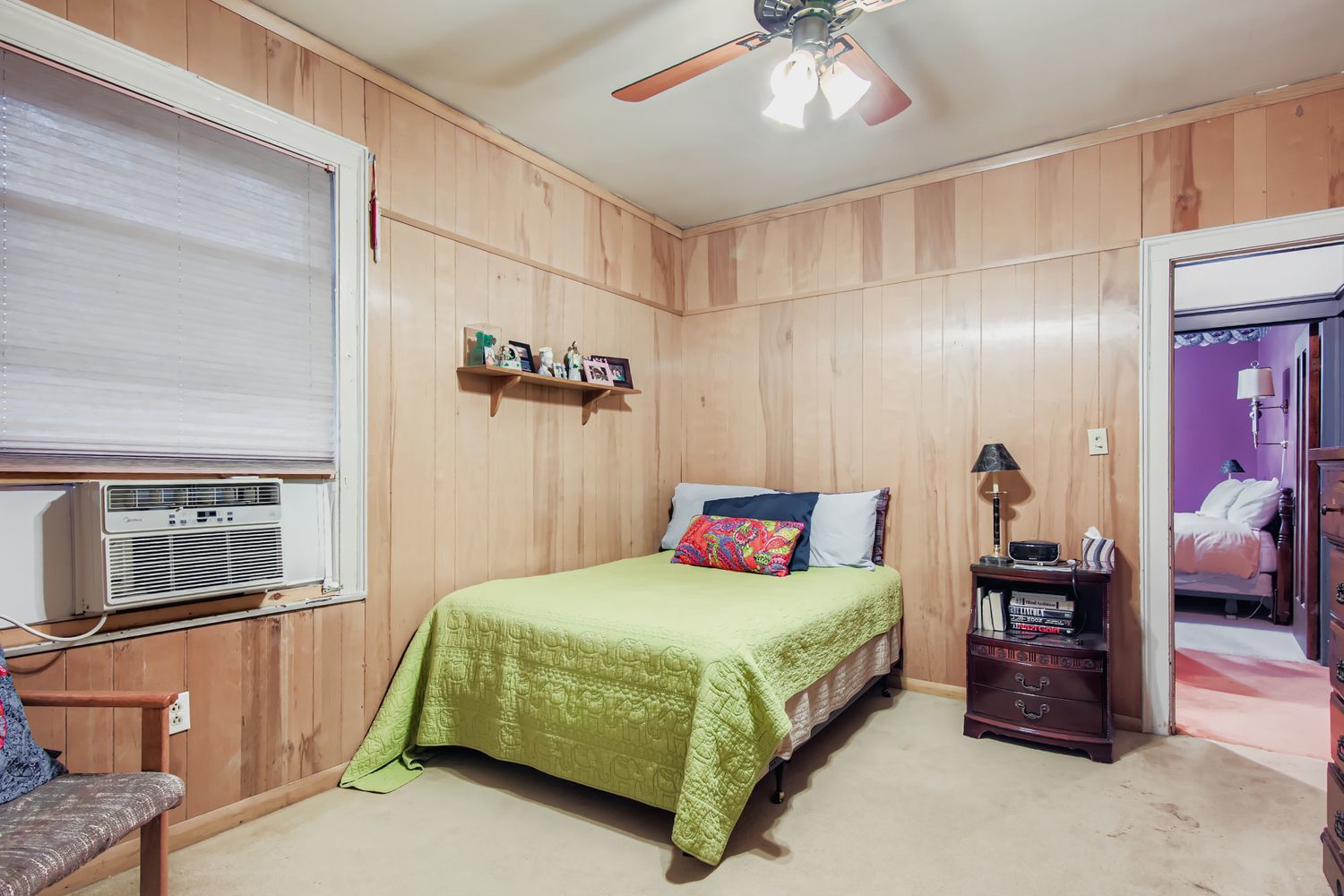 10522 South Leavitt Street Chicago, IL 60643 - Photo 15 of 24 a bedroom with a bed and a chandelier