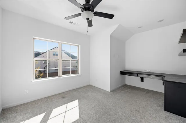 a kitchen with stainless steel appliances kitchen island granite countertop a stove a sink and a refrigerator