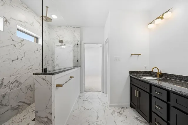 a bathroom with a bathtub and a shower