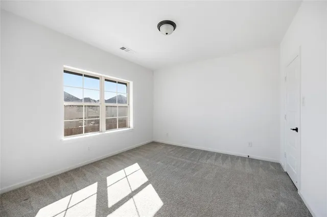 an empty room with closet area