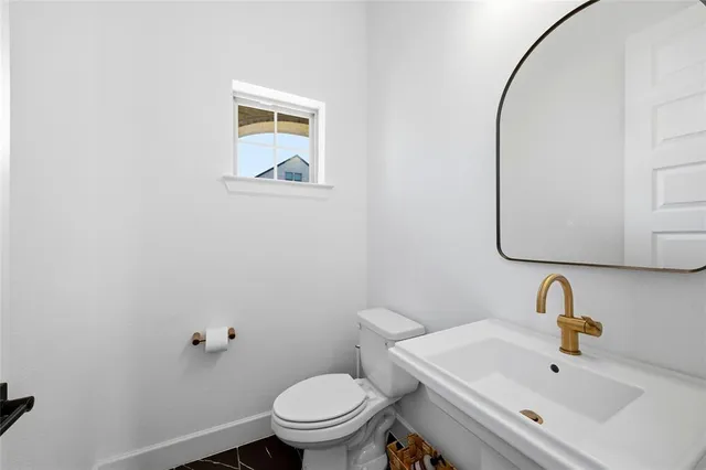 a bathroom with a sink and a toilet